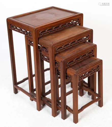 A nest of four Chinese carved rosewood occasional tables, 20...