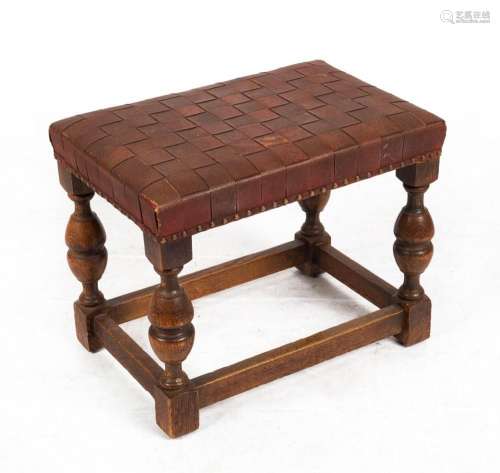 An English oak Elizabethan style stool with plaited leather ...