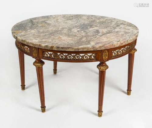 A vintage French circular coffee table with marble top, mid ...