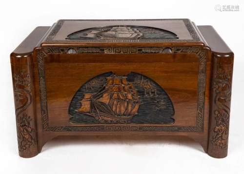 A Chinese carved camphor wood blanket box with sailing ship ...