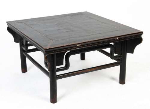 A Japanese square tea table, carved wood with black lacquere...