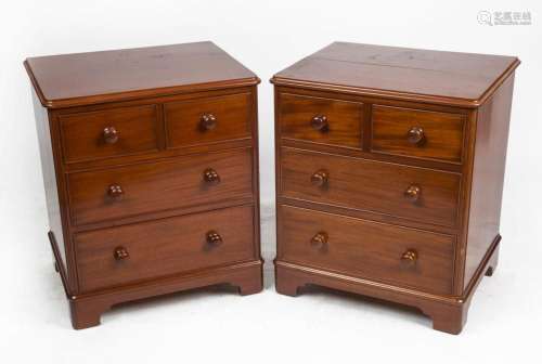 A pair of Victorian style mahogany four drawer bedside chest...
