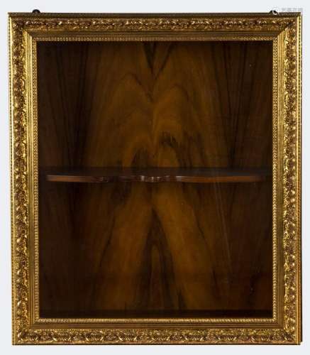 A shadow box wall cabinet with gilt framed door, 20th centur...