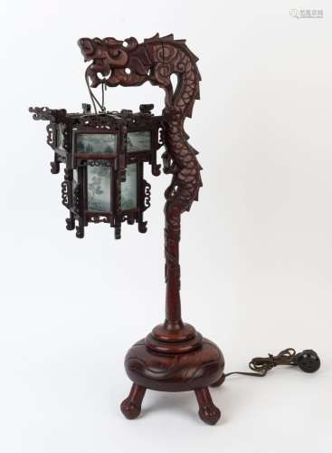 A vintage Chinese dragon lamp, carved wood with hanging shad...