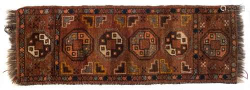 A small and narrow hand-knotted tribal rug, 120 x 41cm