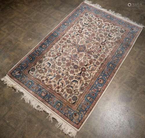 A Persian hand-knotted floral pattern rug with blue and crea...