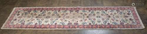 A Persian hand-knotted floral runner with pink and cream gro...