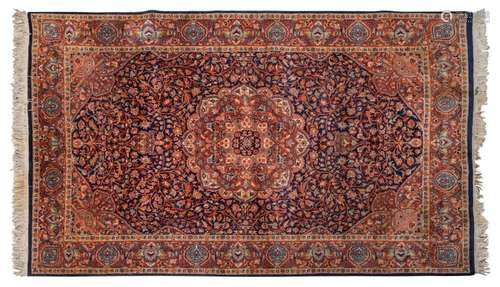 A Pakistani hand knotted pure wool rug with ornate floral mo...