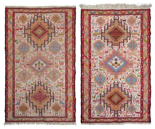 Two hand-knotted flat weave tribal patterned rugs. 42 x 100c...