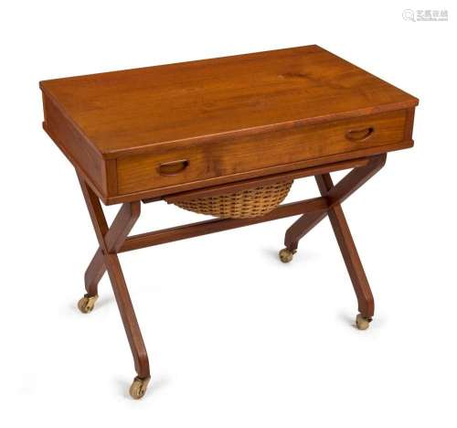 A Danish teak sewing tidy worktable with basket undercarriag...