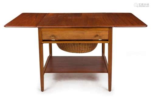 A vintage Danish teak drop-side worktable with basket underc...