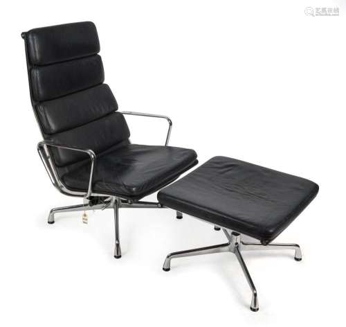 EAMES replica armchair and foot stool, chrome and black leat...