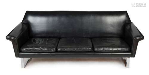 A vintage black leather three seat settee with chrome skid b...