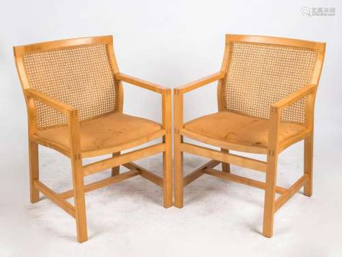 A pair of Scandinavian blond timber armchairs with camel lea...
