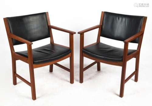 A pair of Danish teak elbow chairs with black vinyl upholste...