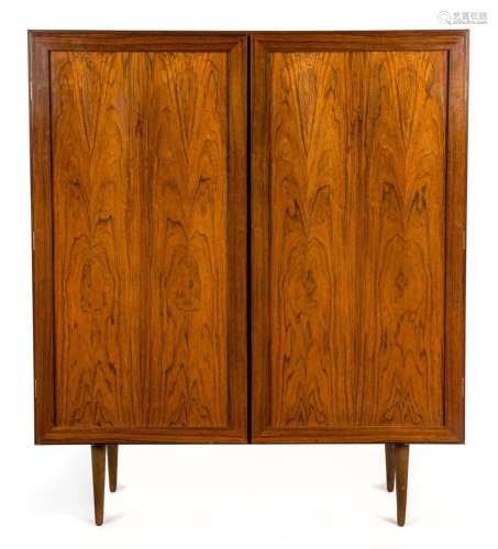 A Danish rosewood two door cabinet, interior fitted with adj...