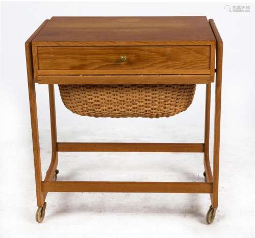 A vintage Danish teak worktable, single drawer and wicker un...