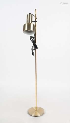 A modern standard lamp with metal shade, Note: Plug has been...