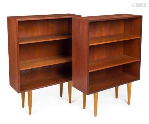 A pair of vintage Danish teak open faced bookcases of petite...