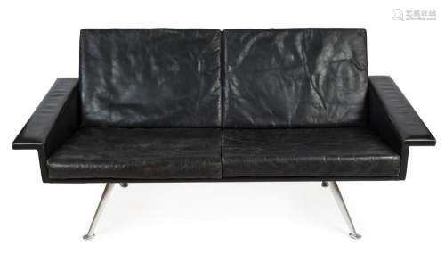 A retro black leather two seat settee with splayed chrome le...