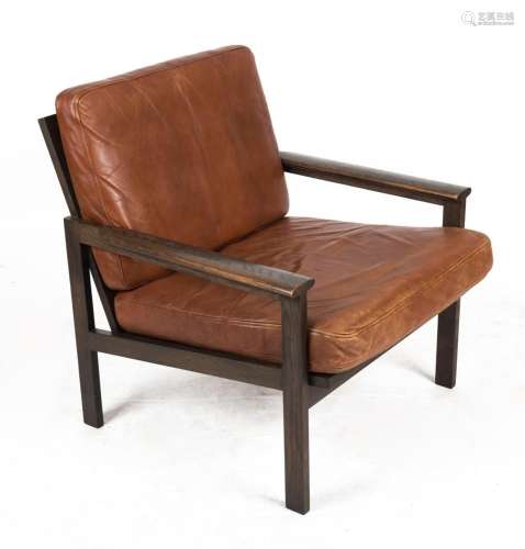 A vintage Danish armchair with tan leather and dark stained ...