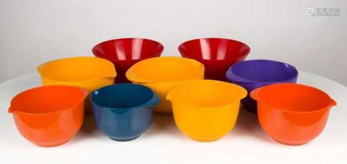 Nine assorted vintage Danish coloured plastic bowls, the lar...