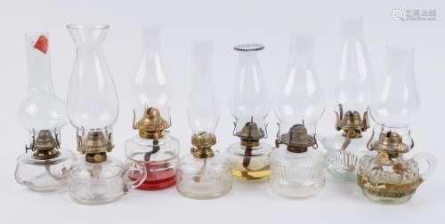 A collection of eight early 20th century portable kerosene l...