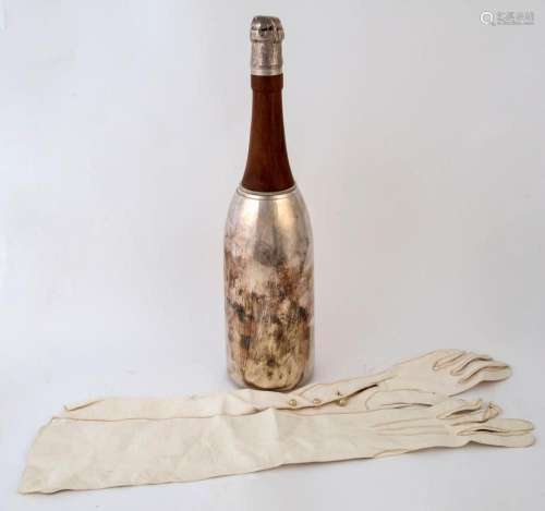 A vintage cocktail shaker in the form of a champagne bottle ...