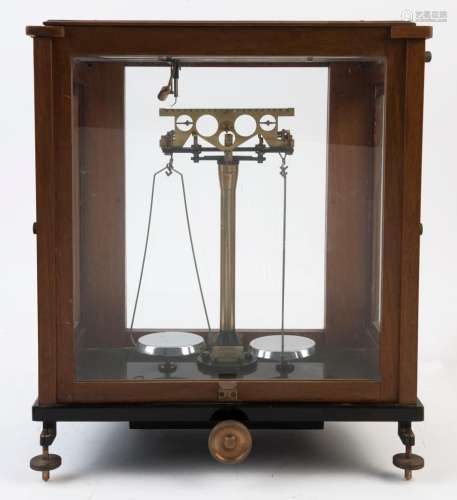 A set of scientific balance scales in timber and glass case,...