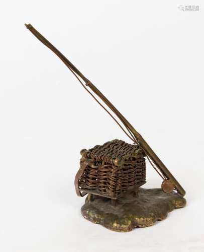 FISHING ROD & BASKET PAPERWEIGHT: in brass with the bask...