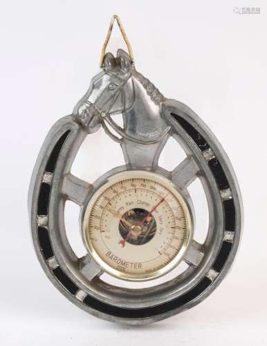 A vintage Japanese wall barometer in horseshoe frame, mid 20...