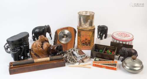Carved wooden elephants, cast metal chess pieces, chain and ...