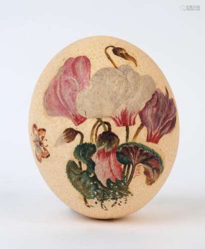 A folk art hand-painted ostrich egg with butterfly and flora...