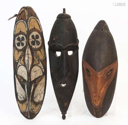 Three tribal masks, carved and painted wood, Papua New Guine...
