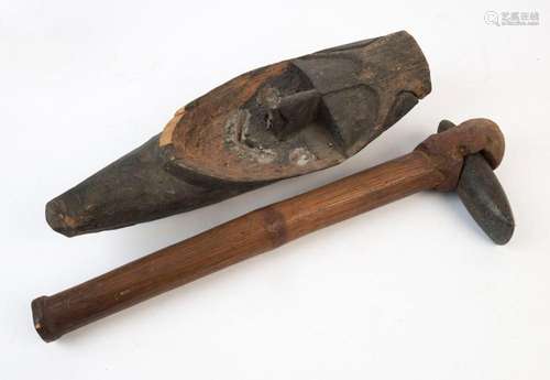 A carved wooden mask, and a stone and bamboo axe, Papua New ...