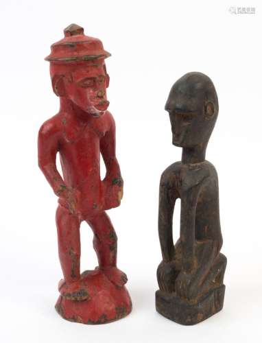 Two figural statues, carved wood with red and black painted ...