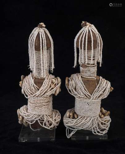 Two fertility dolls, carved wood, beads and shell, Fali trib...