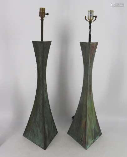 A Pair Of patinated Metal Giacometti Style Lamps.