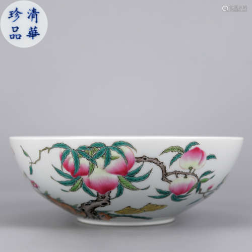 A RARE FAMILLE ROSE FLOWER AND BUTTERFLY PEACH BOWL