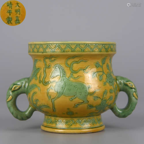 A YELLOW GROUND GREEN COLORED AN-CARVED SEA MONSTER DOUBLE-E...