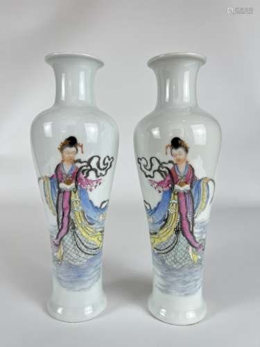 A pair of famille rose vases, marked.