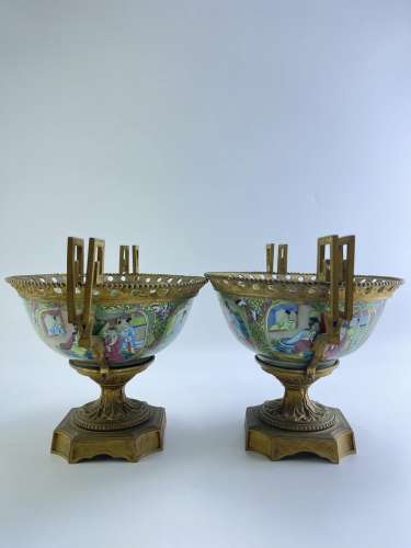 A pair of Cantonese enamel bowls decorated with copper stand...