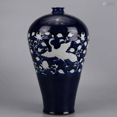 A BLUE GLAZED REVERSE DECORATED CARVED PHOENIX AND PEONY MEI...