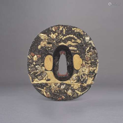 A GOLD AND SILVER DECORATED SHAKUDO TSUBA WITH WARRIORS FIGH...