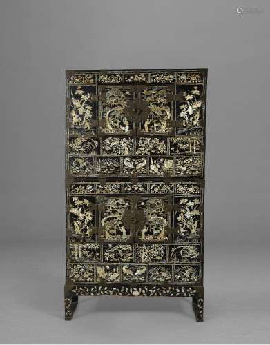 A TWO-TIERED LACQUER AND MOTHER-OF-PEARL CHEST WITH A STANDJ...