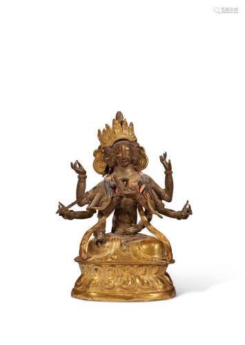 A GILT-BRONZE REPOUSSE FIGURE OF USHNISHAVIJAYA MONGOLIA, DO...