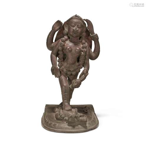 A BRONZE FIGURE OF KALI NORTH INDIA OR NEPAL, 19TH CENTURY