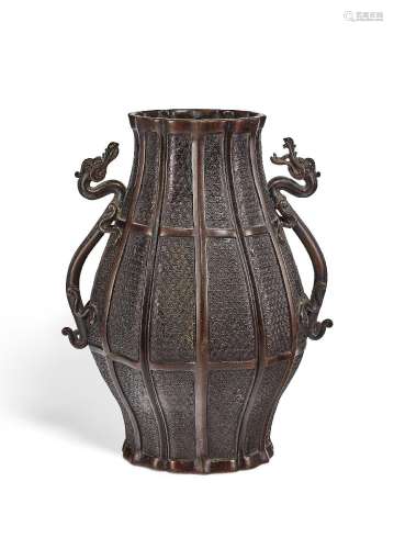 A BRONZE OVOID VASE WITH DRAGON-FORM HANDLES.CHINA, 17TH CEN...
