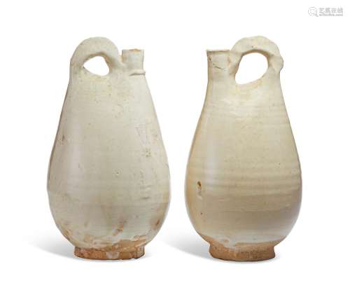 A PAIR OF WHITE-GLAZED POTTERY FLASKS  LIAO DYNASTY (AD 907-...