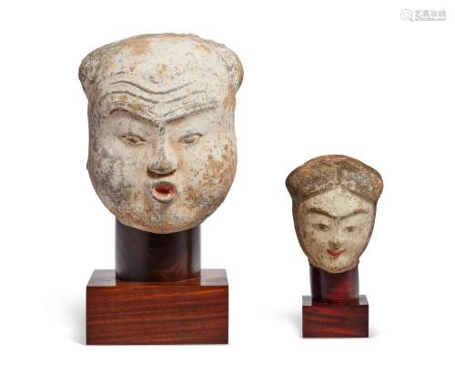 TWO PAINTED POTTERY HEADS  HAN DYNASTY (206 BC-AD 220)